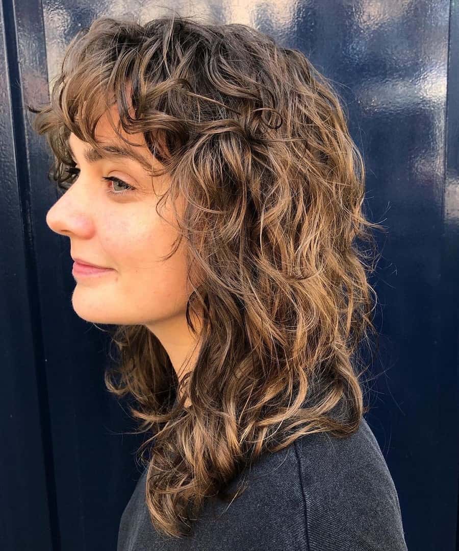 woman with curly shag haircut