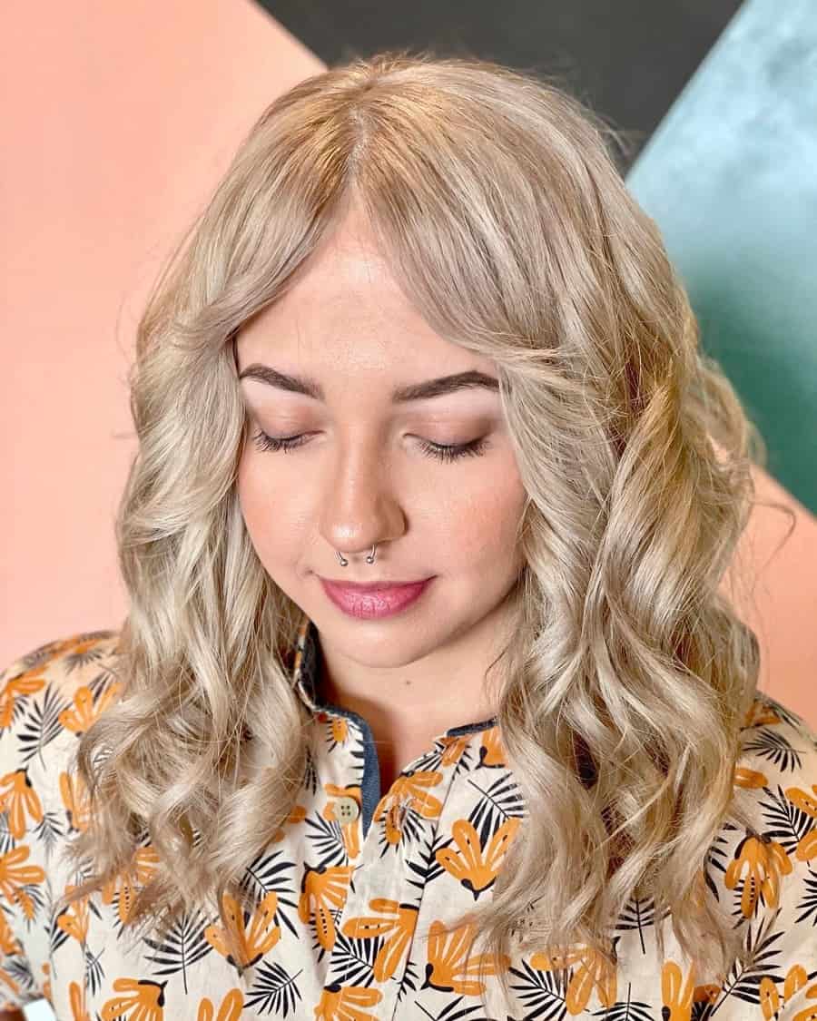 long curly shag haircut with blonde hair